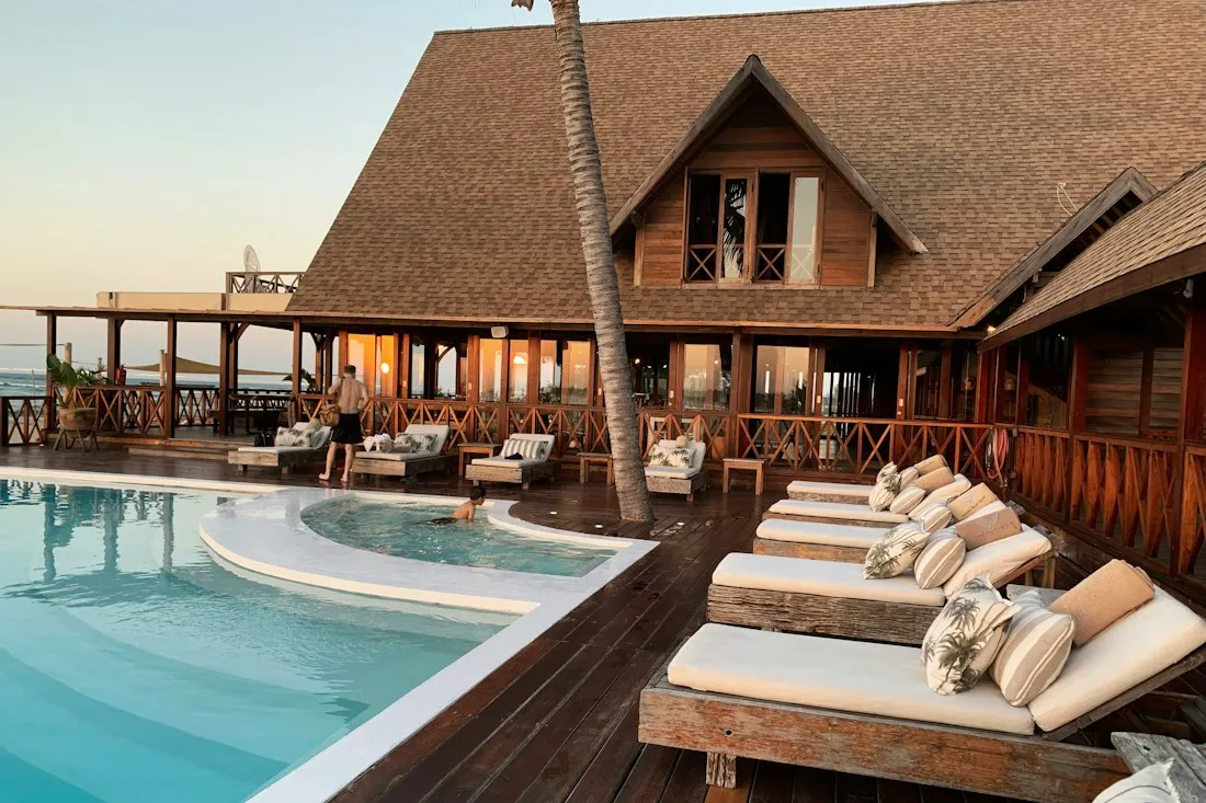 A tranquil resort suite in a lush tropical landscape