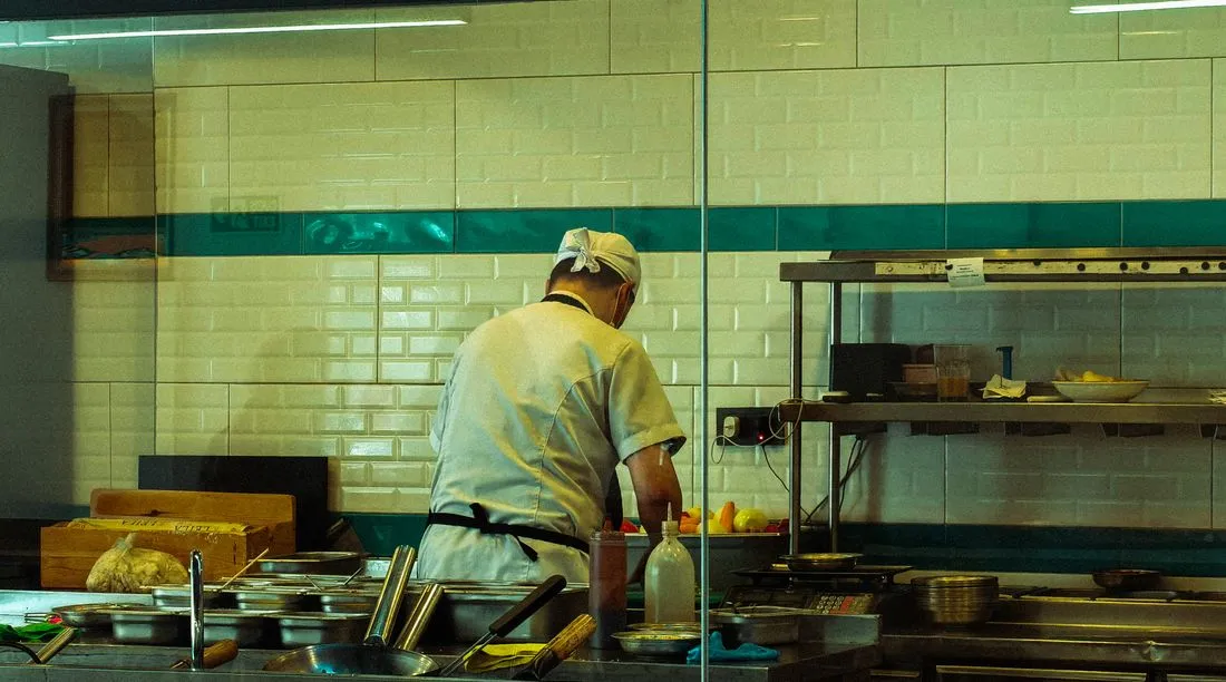 Restaurant kitchen atmosphere illustrating a thoughtful cooking process